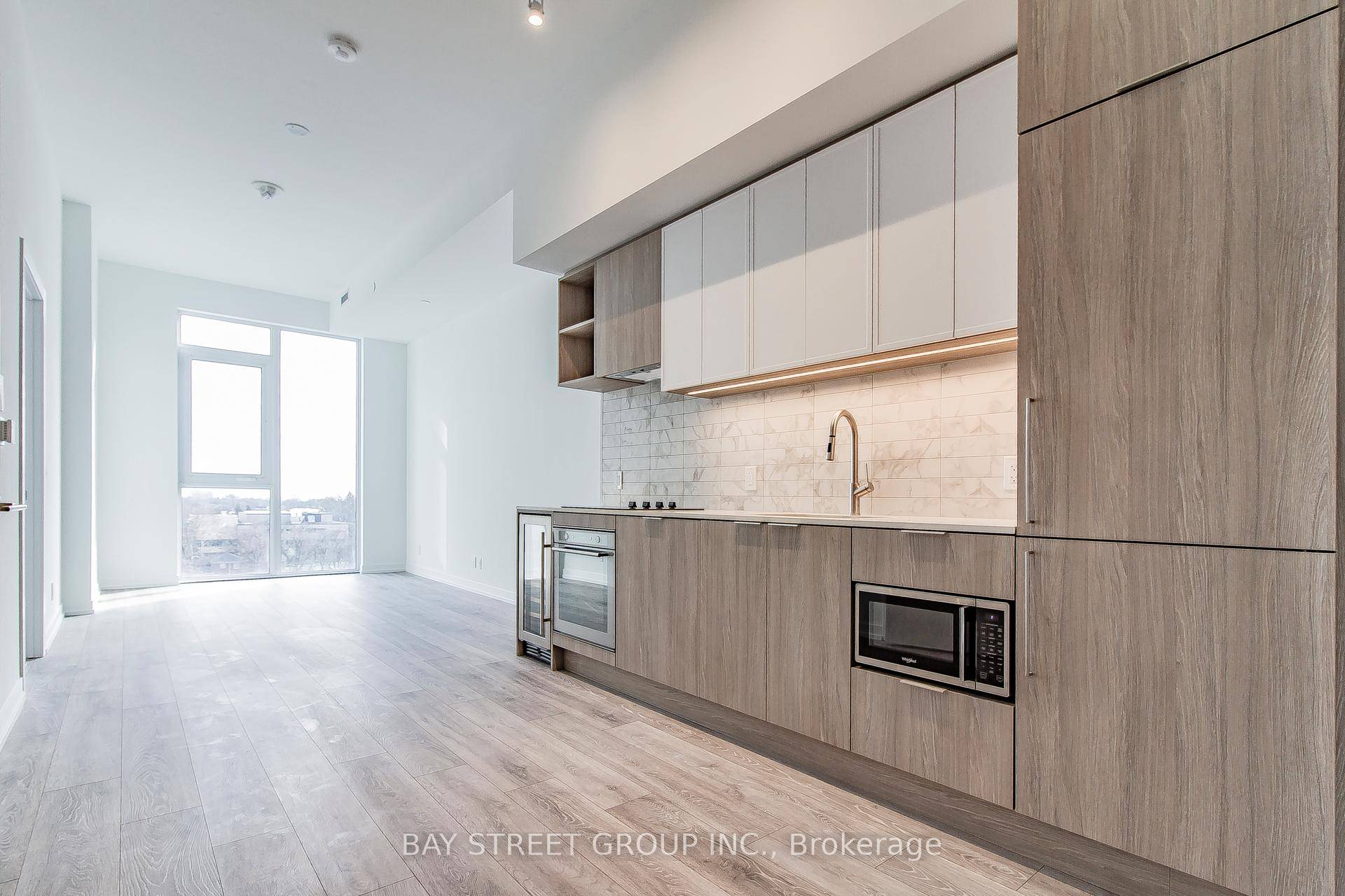 Luxury condo 2 bedrooms, 2 bathrooms, a den with sliding door, a fully integrated kitchen, a wine bar, a generous sized terrace perfect for entertaining guests, and 24 7 concierge.