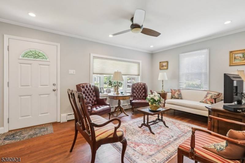 Charming Cape Cod with 3 BR, 2 full Baths, 2 car oversized garage Family Room off Kitchen on 4 10th flat acre with updated newly heated in ground pool.