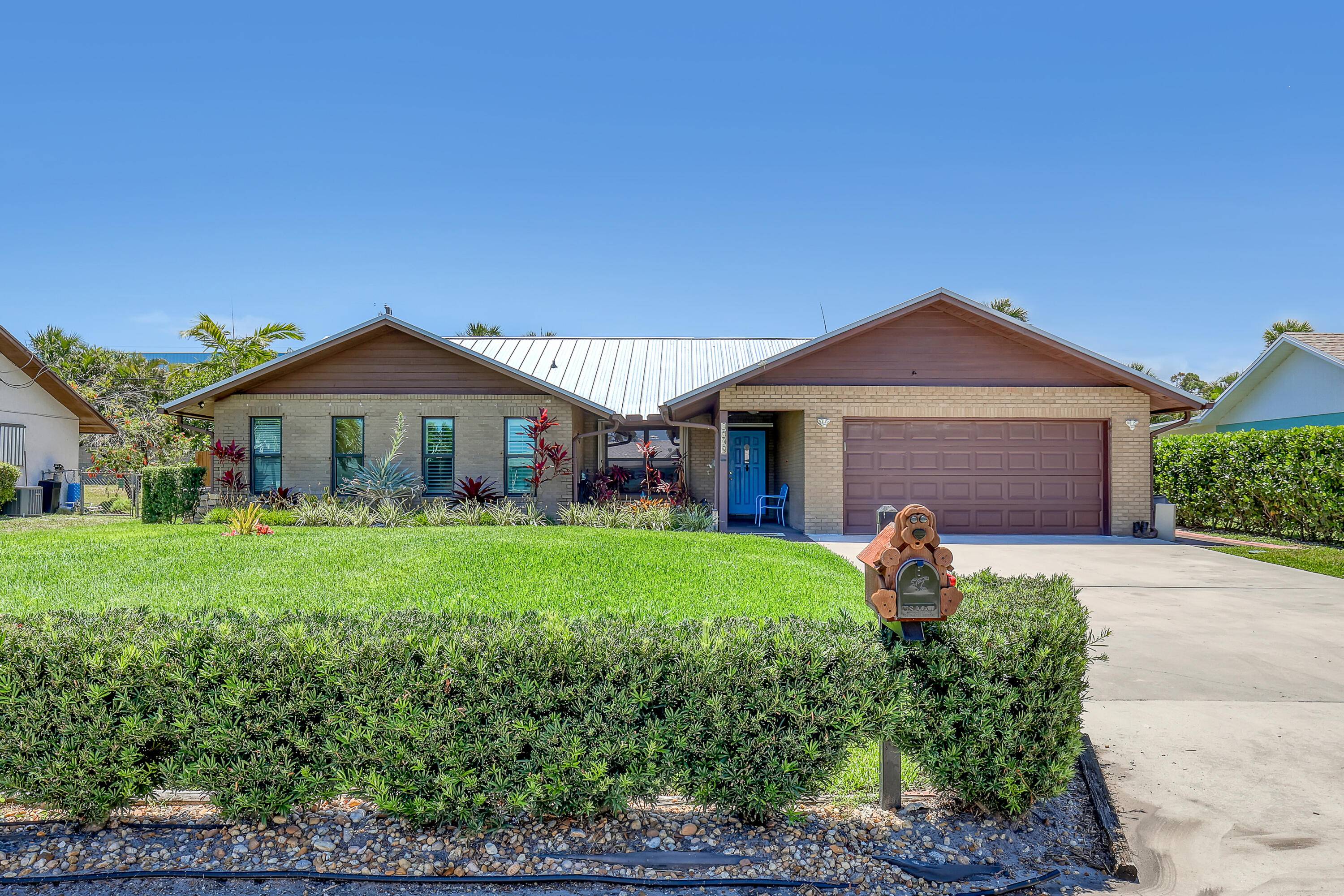 New metal roof, whole house generator, impact windows, pool, 400 SF screened lanai, new A C, 3 bed 2 full bath, no maintenance, solid brick construction with 2 car attached ...