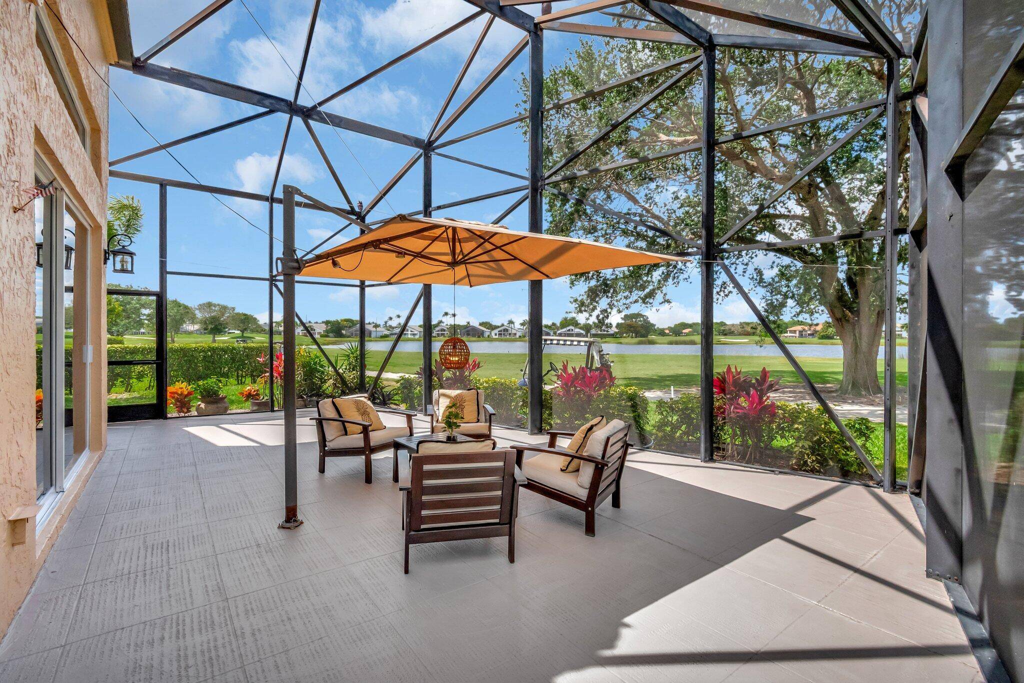 LUXURIOUS DECORATOR DESIGNED, REMODELED LAKEFRONT HOME WITH PANORAMIC GOLF VIEWS LOCATED IN INDIAN SPRING COUNTRY CLUB, A NON MANDATORY MEMBERSHIP GOLF COMMUNITY.