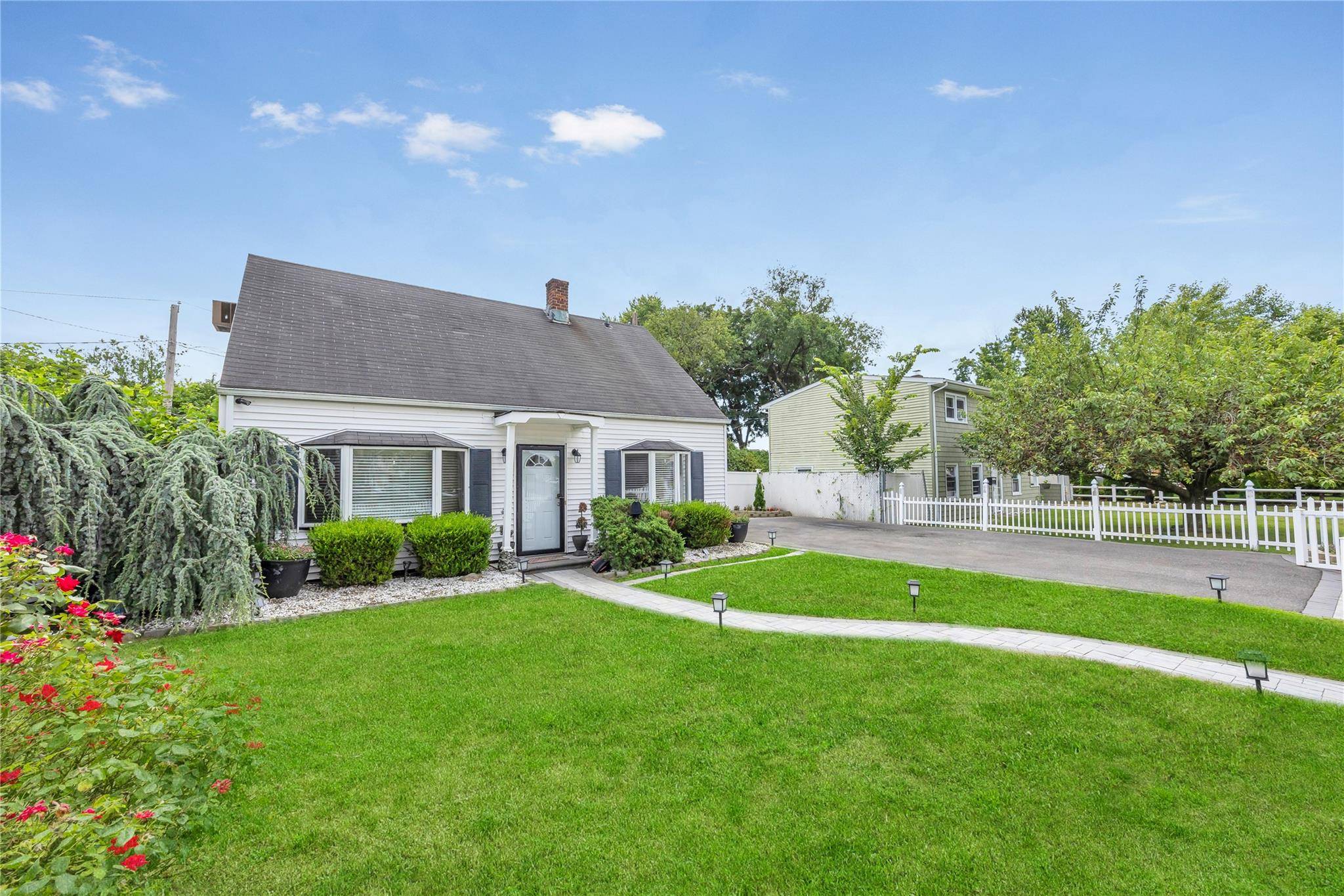 Welcome to this charming 3 bedroom, 2 bathroom home nestled on a peaceful street in the heart of Levittown.