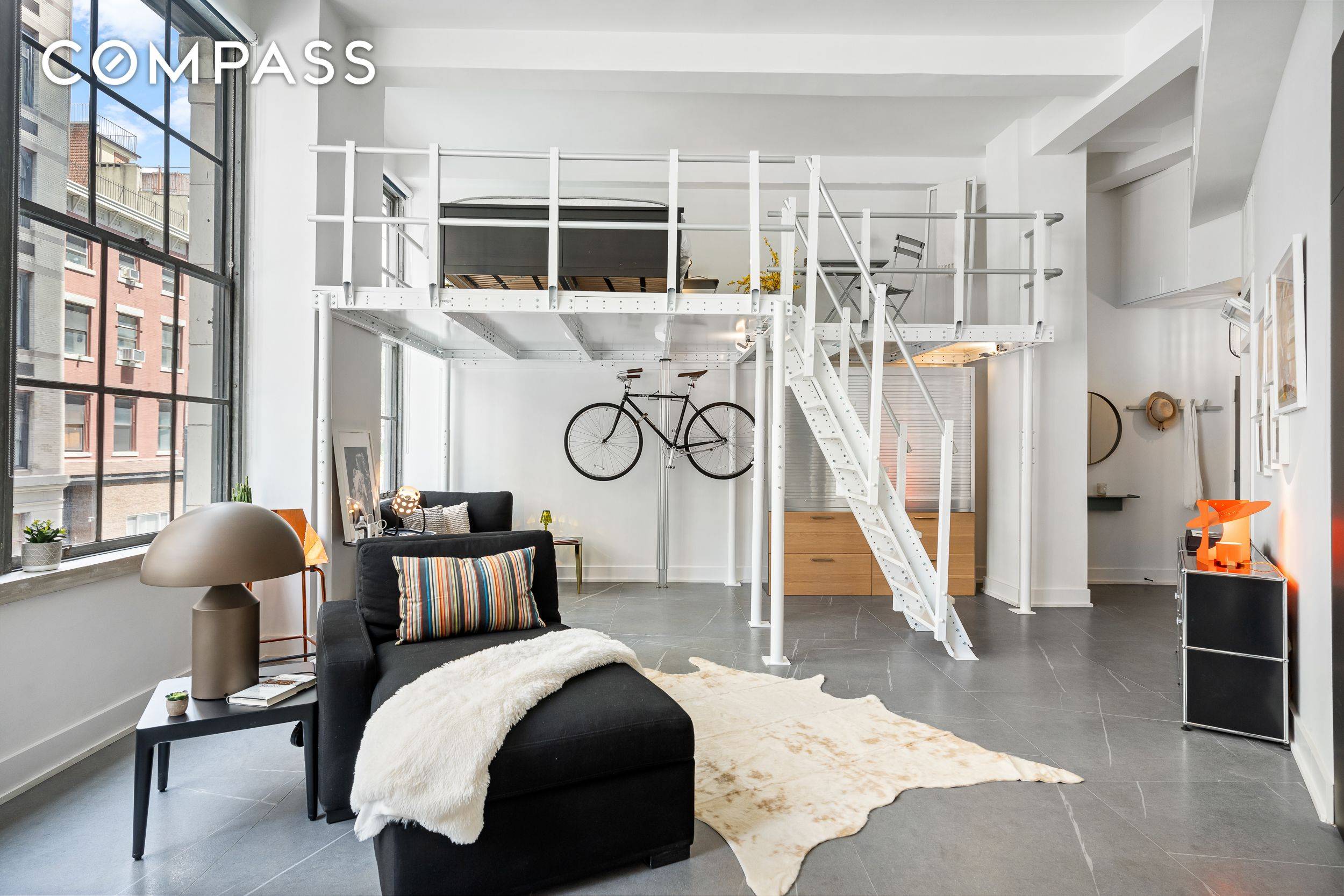 This incredibly unique, 1 bedroom loft apartment is on the SECOND FLOOR and perched above a double height ground floor of the International Tailoring Company Building, which is one of ...
