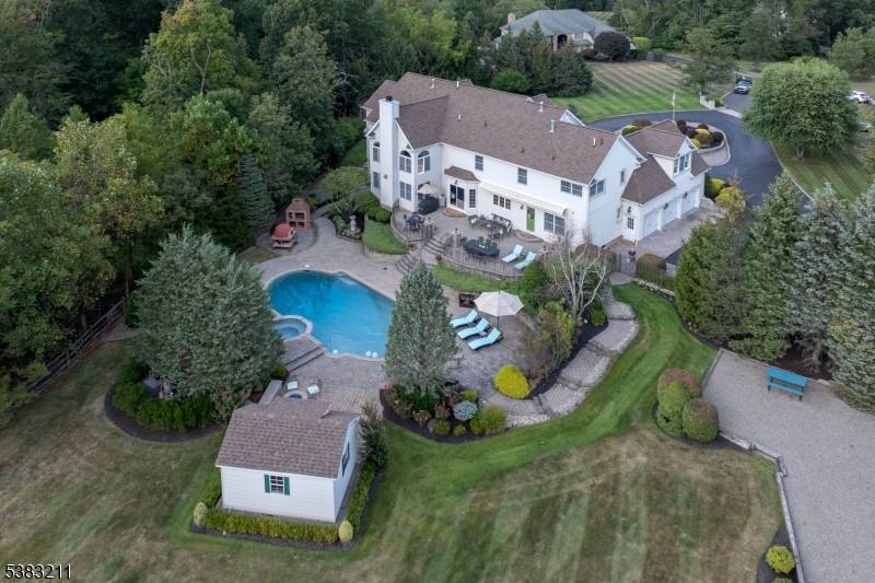 This exceptional Basking Ridge residence offers spacious living and effortless entertaining, both indoors and out.