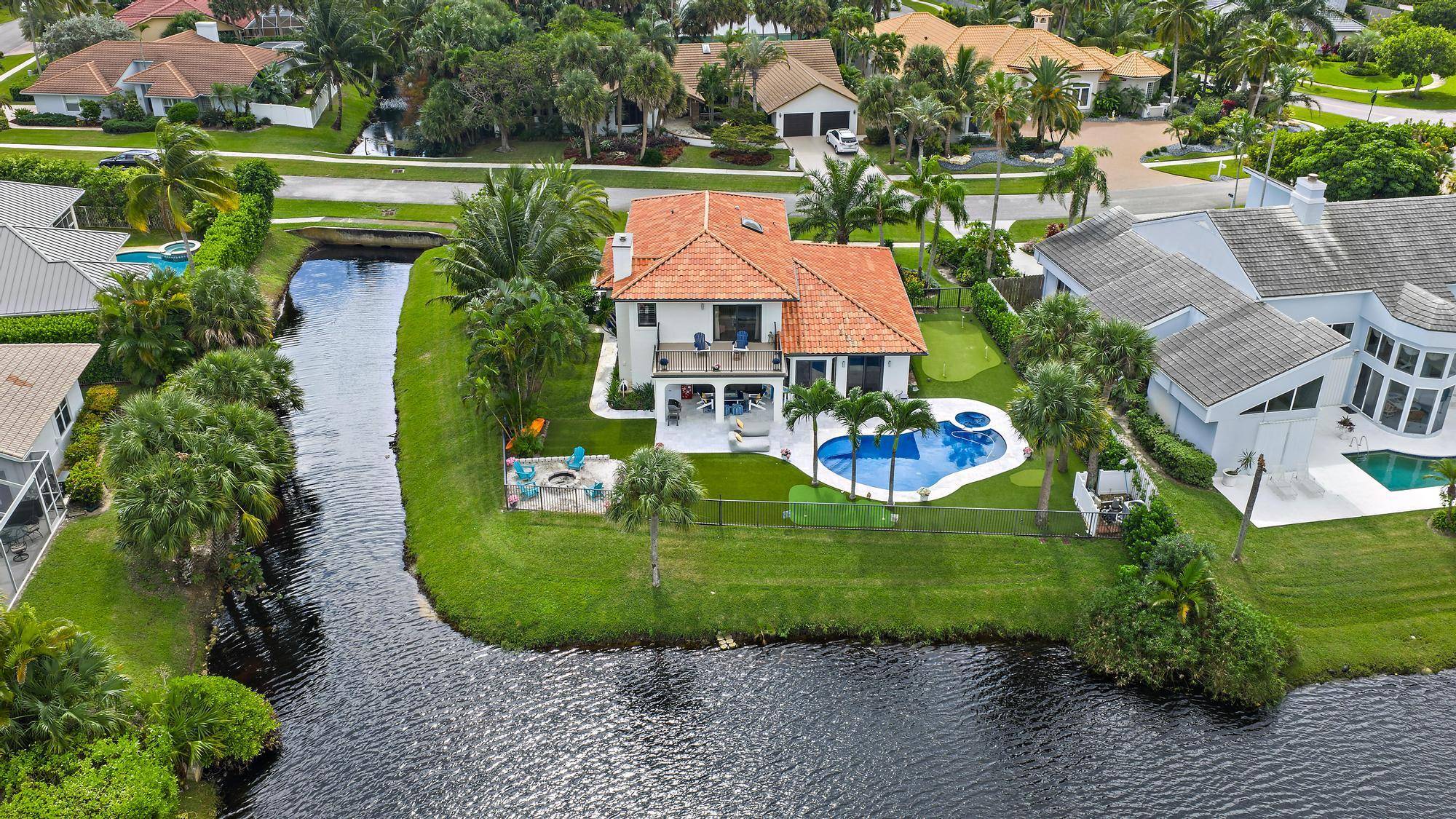 Live the ultimate beach side lifestyle in this newly renovated designer home just steps from the sand in one of Jupiter's most desirable custom home communities Olympus.