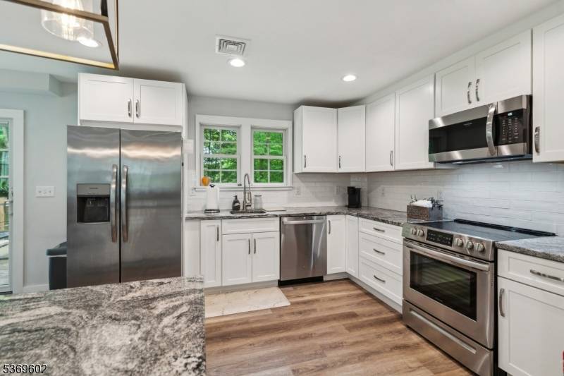 Welcome to 68 Pleasant Hill Rd, Randolph a fully renovated colonial residence in the desirable Ironia.