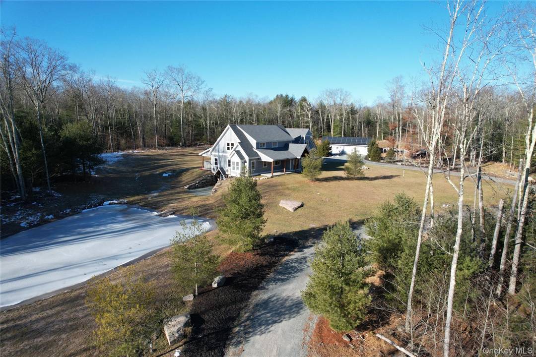 Gorgeous mini estate with lake access and personal swimming pond borders 100 s of acres of NYS land and will not disappoint !