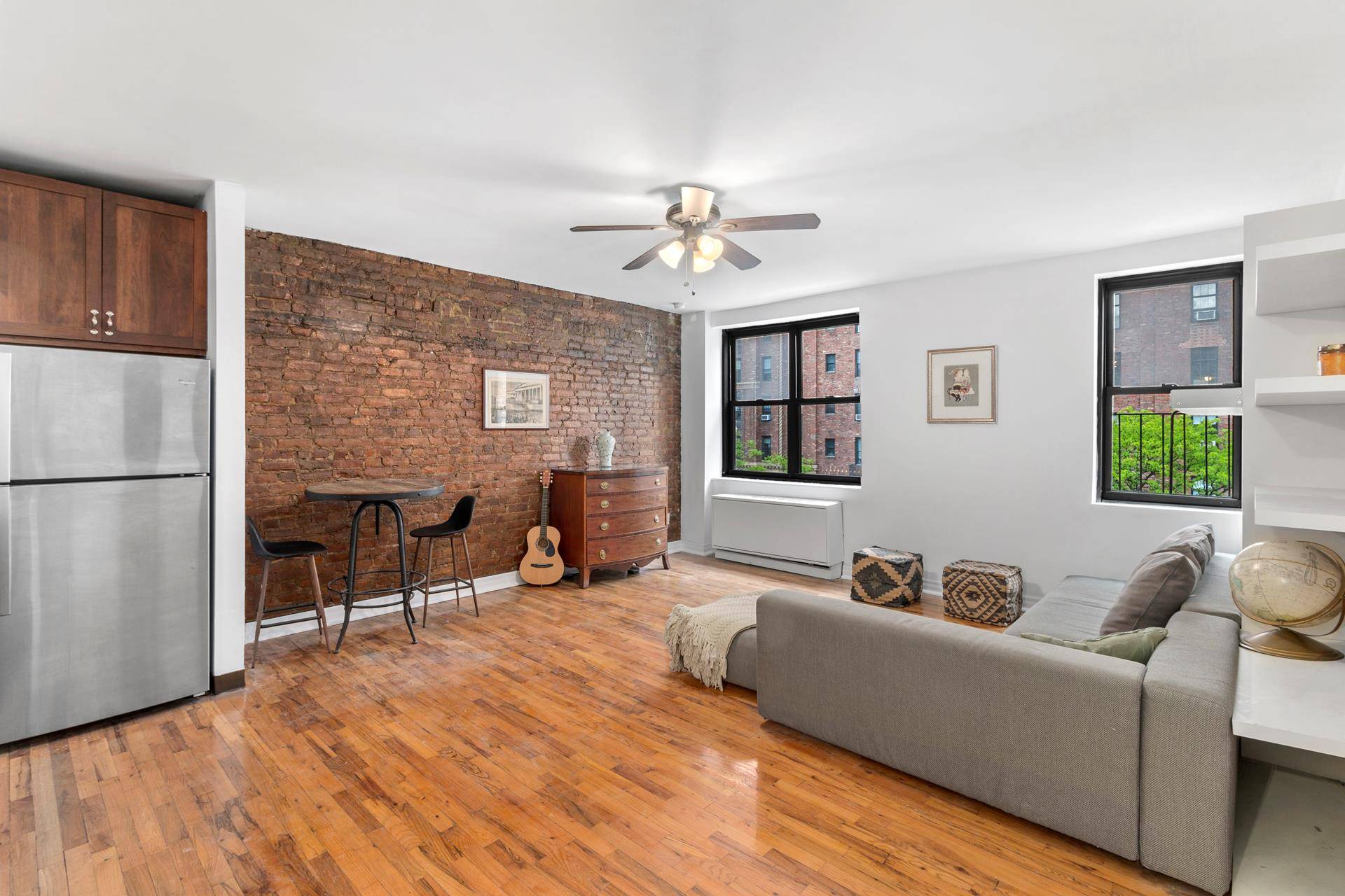 This large and sunny studio co op apartment is perfectly set on a beautiful tree lined street in the heart of Chelsea.