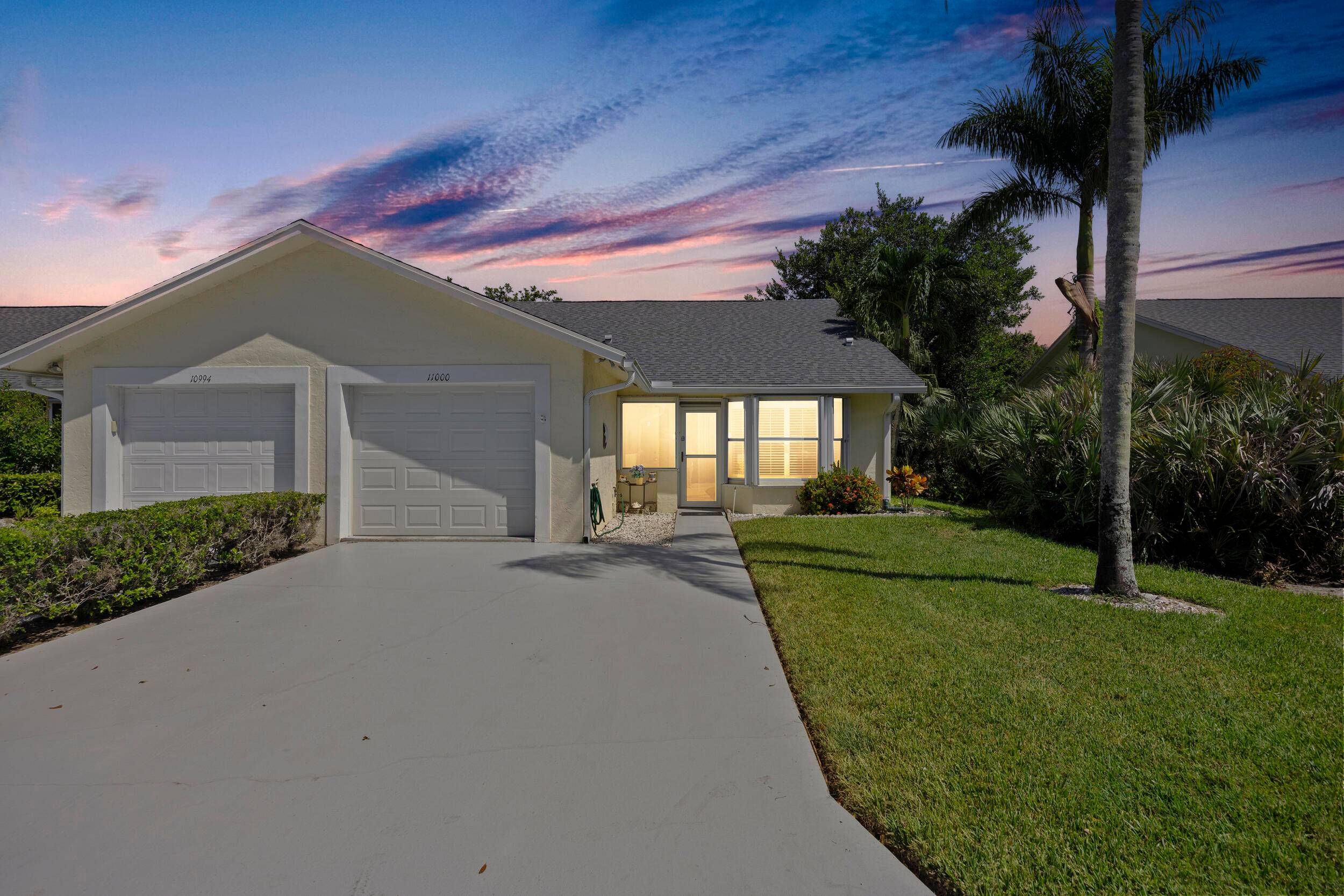 Sun soaked and move in ready, this 1300 square foot CORNER 2 bedroom 2 bathroom villa with 1 car garage checks every box.