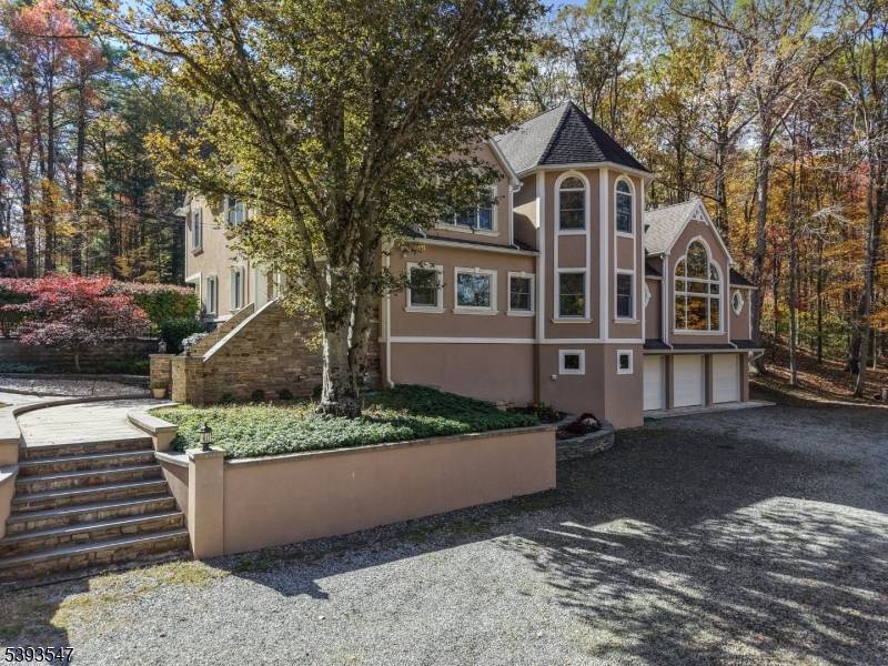 Tucked away on one of Wanaque's most private roads, this beautifully updated custom built Colonial is surrounded by nature and serenity.