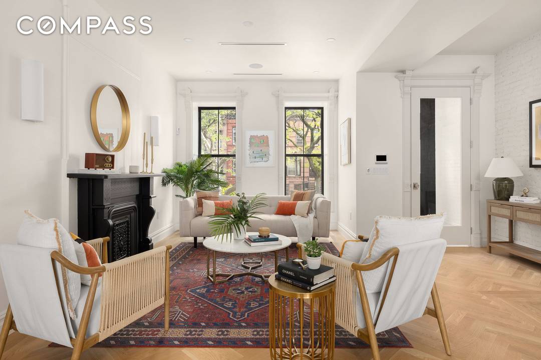 This meticulously renovated single family home offers five bedrooms, four full bathrooms, and two powder rooms, combining impressive scale with a layout designed for both everyday living and entertaining.