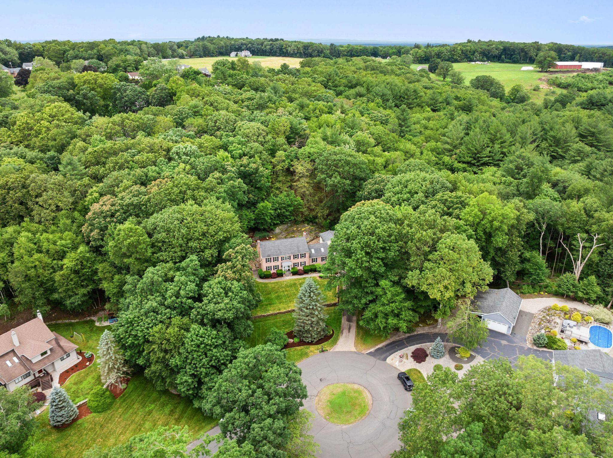 Experience refined New England living in this masterfully crafted colonial, set on 1.
