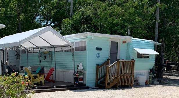 Charming, perfectly suited for relaxation, beach trailer home for sale Welcome to your carefree oasis.