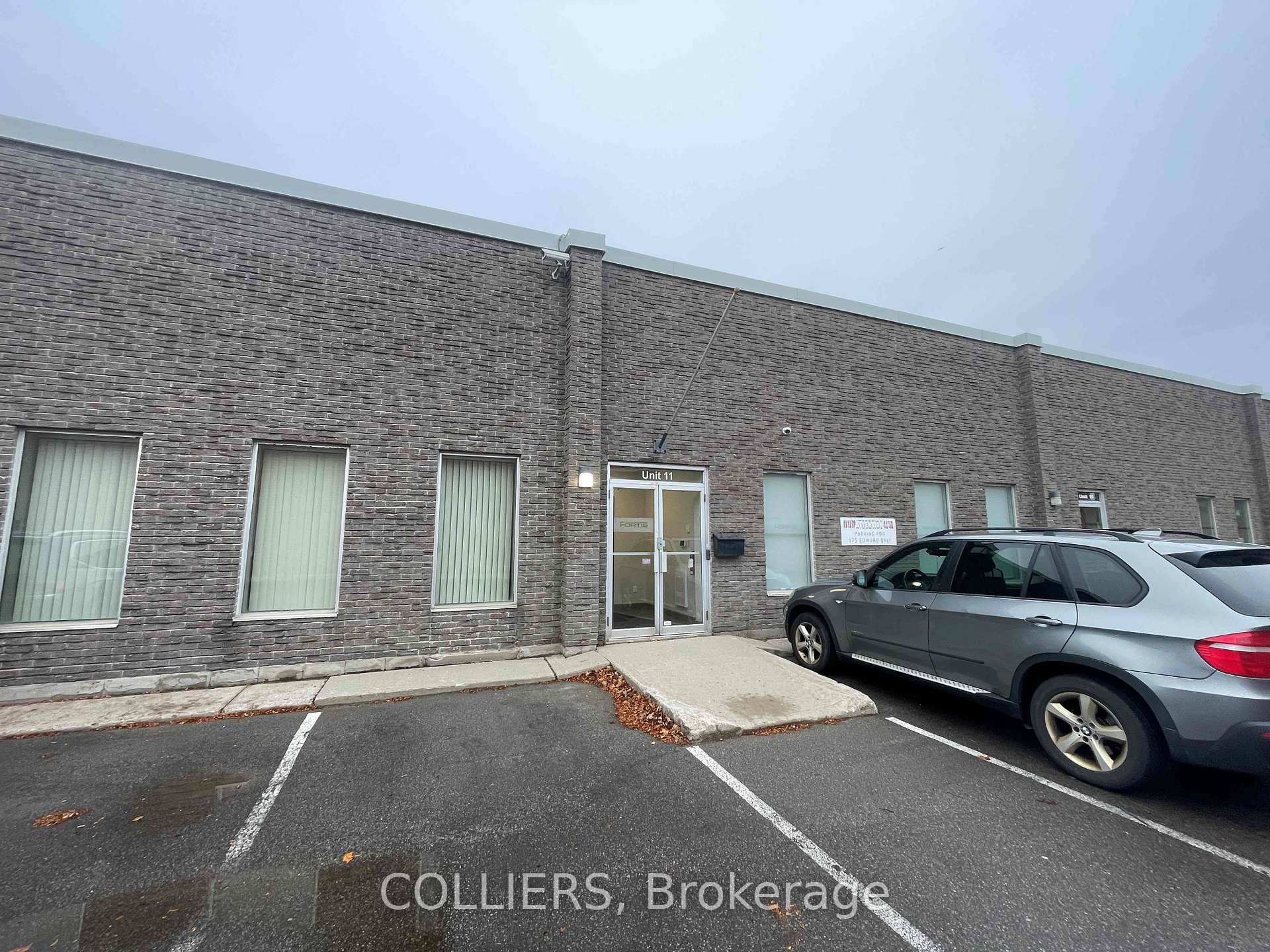 Nicely finished office area with a mix of private office, open space, and kitchenette.