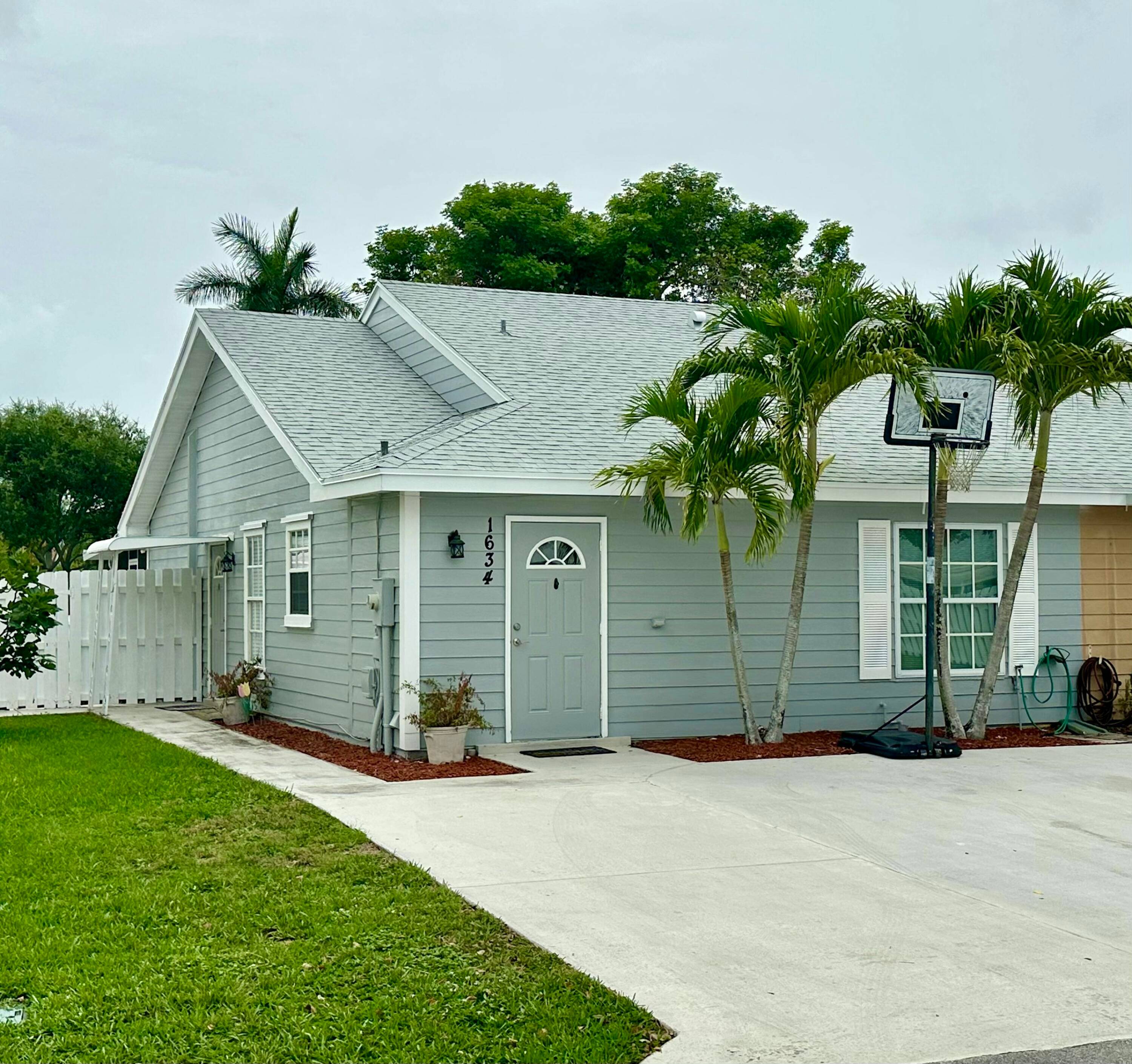This spacious townhouse features a bright and open floor plan with tile flooring throughout.