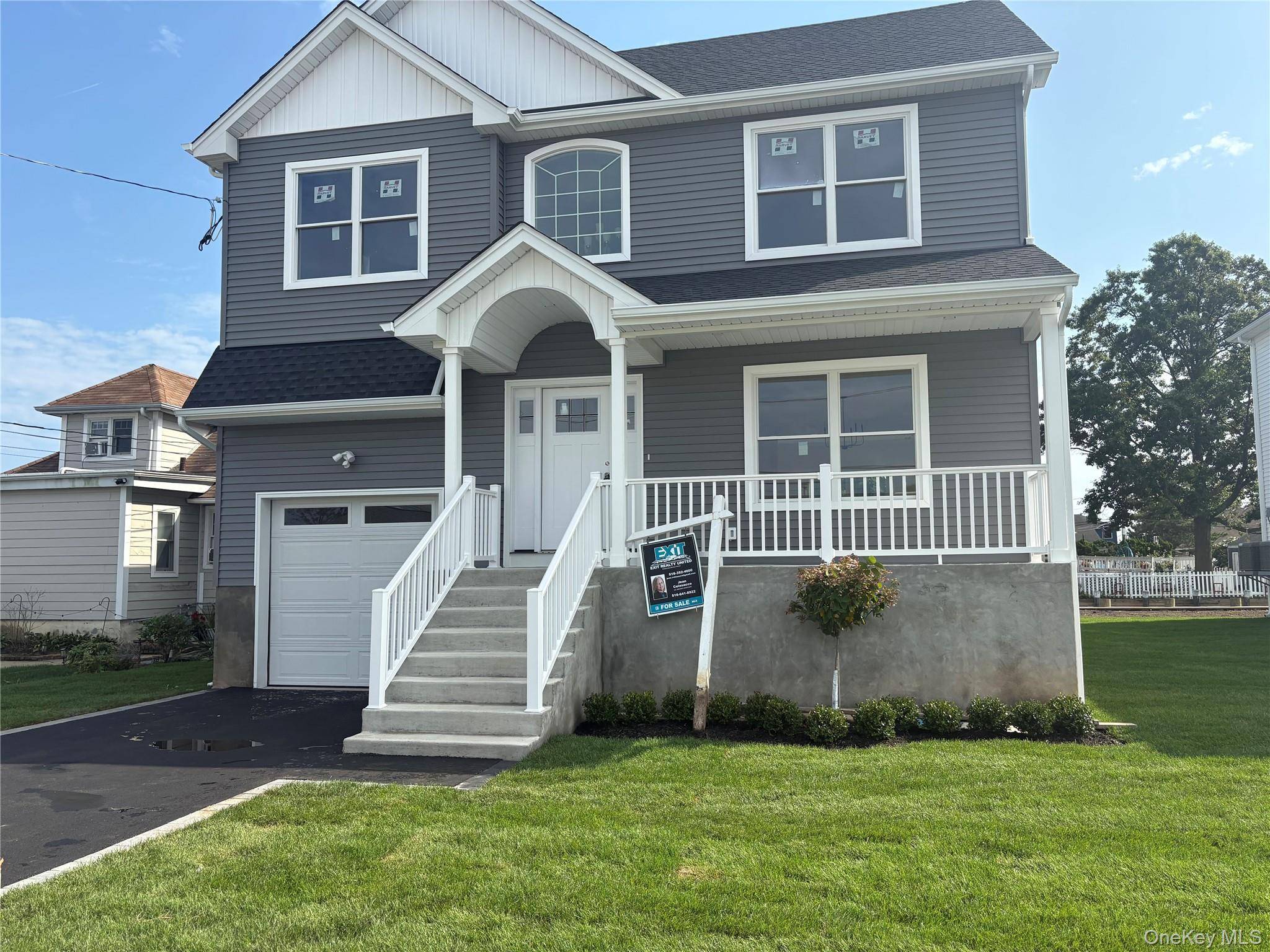 A newly constructed colonial waterfront residence is available in Baldwin Harbor.