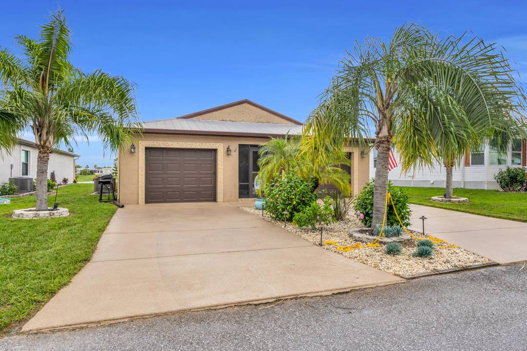 Welcome to this beautifully maintained home in Spanish Lakes Fairways, a vibrant 55 community in Fort Pierce.