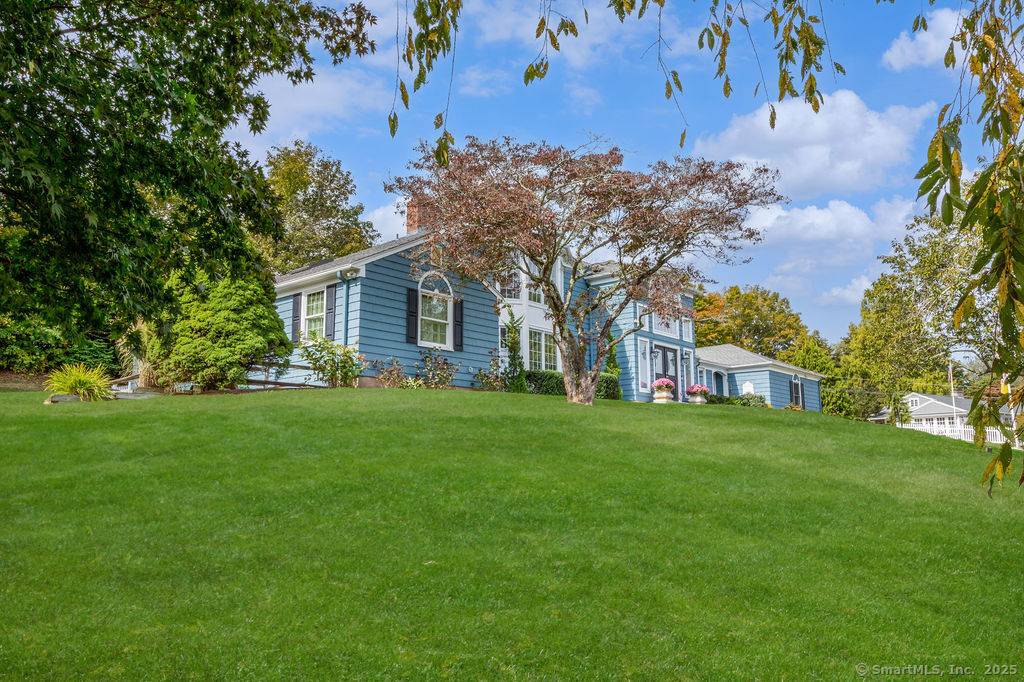 Sprawling Contemporary fully renovated and nestled within the Pine Orchard Association ; set back on a large corner lot.