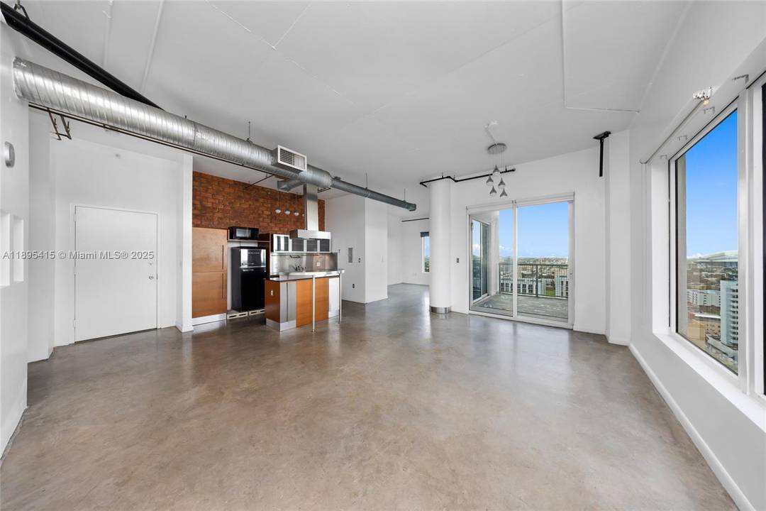 Experience the best of Miami living in this stunning 2BD 1BA corner penthouse loft featuring 925 sq.