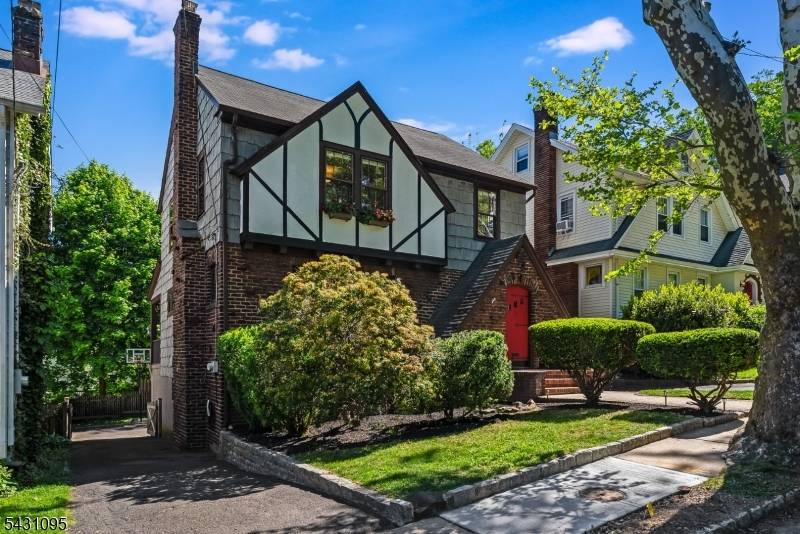 Step into the charm of 15 Rynda Road, a storybook Tudor where timeless character meets modern comfort.
