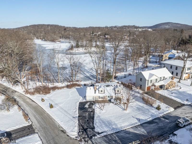 Beautifully set on a picturesque, level lakefront lot in the highly sought after Rock Ridge section of Denville, this charming Cape Cod style home offers year round lake views and ...