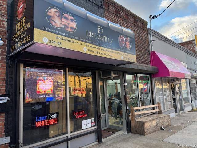 Mixed use property featuring two ground floor retail storefronts and three to four residential rental units.