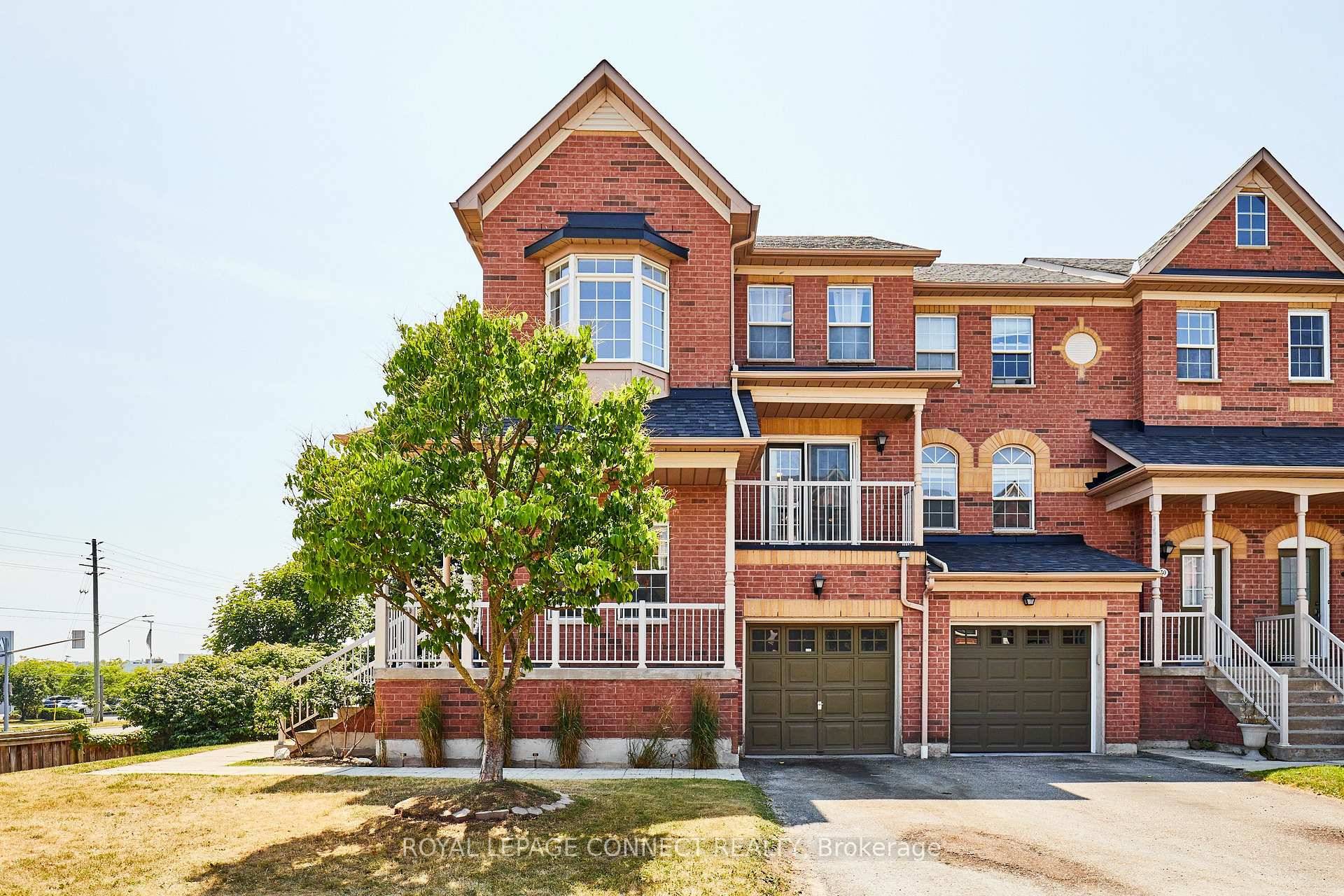 End Unit Townhome with a Welcoming Wrap Around Porch in Woodlands Pickering !
