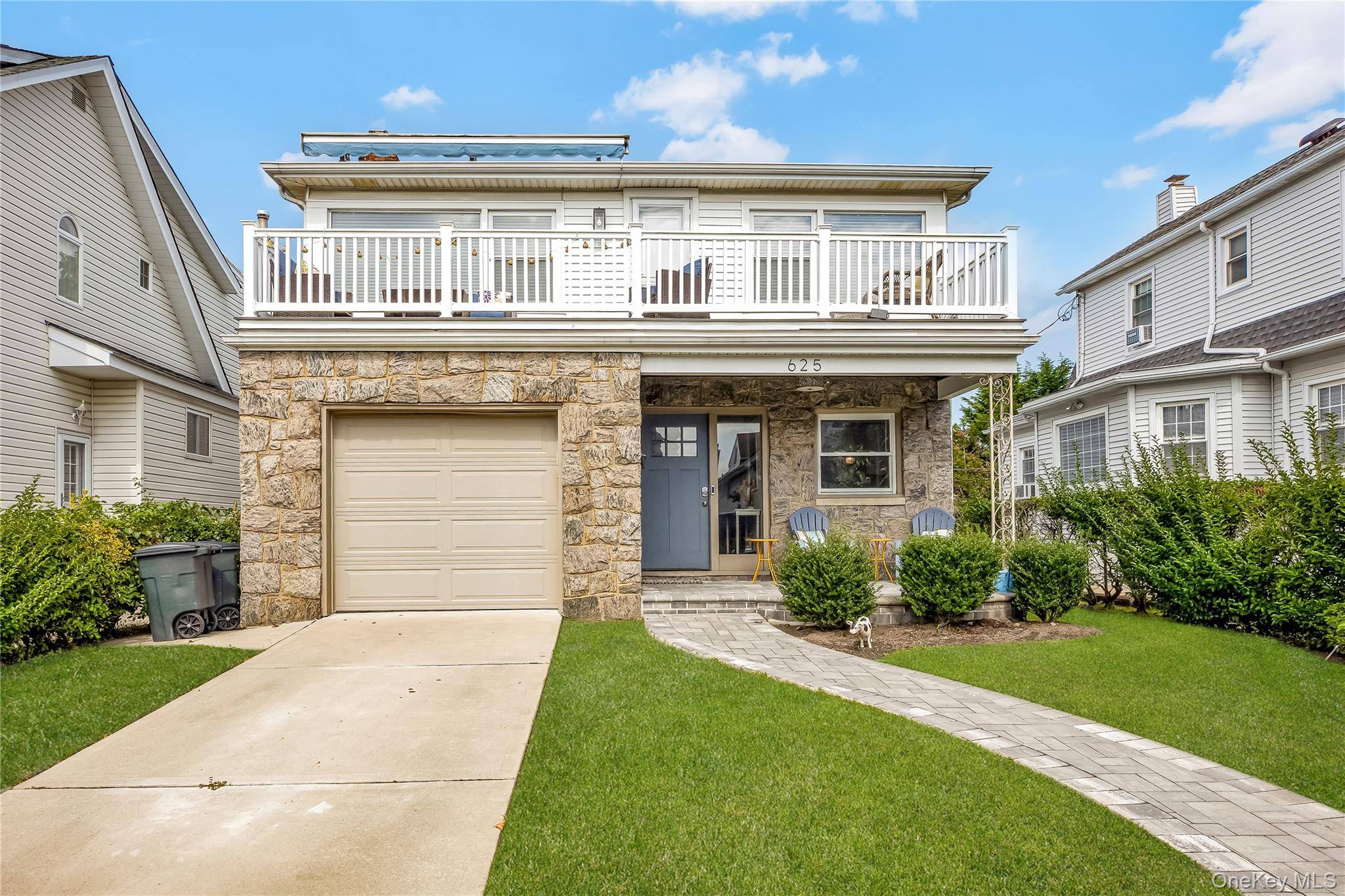 Beautifully renovated two family in the East End on the Beachside.