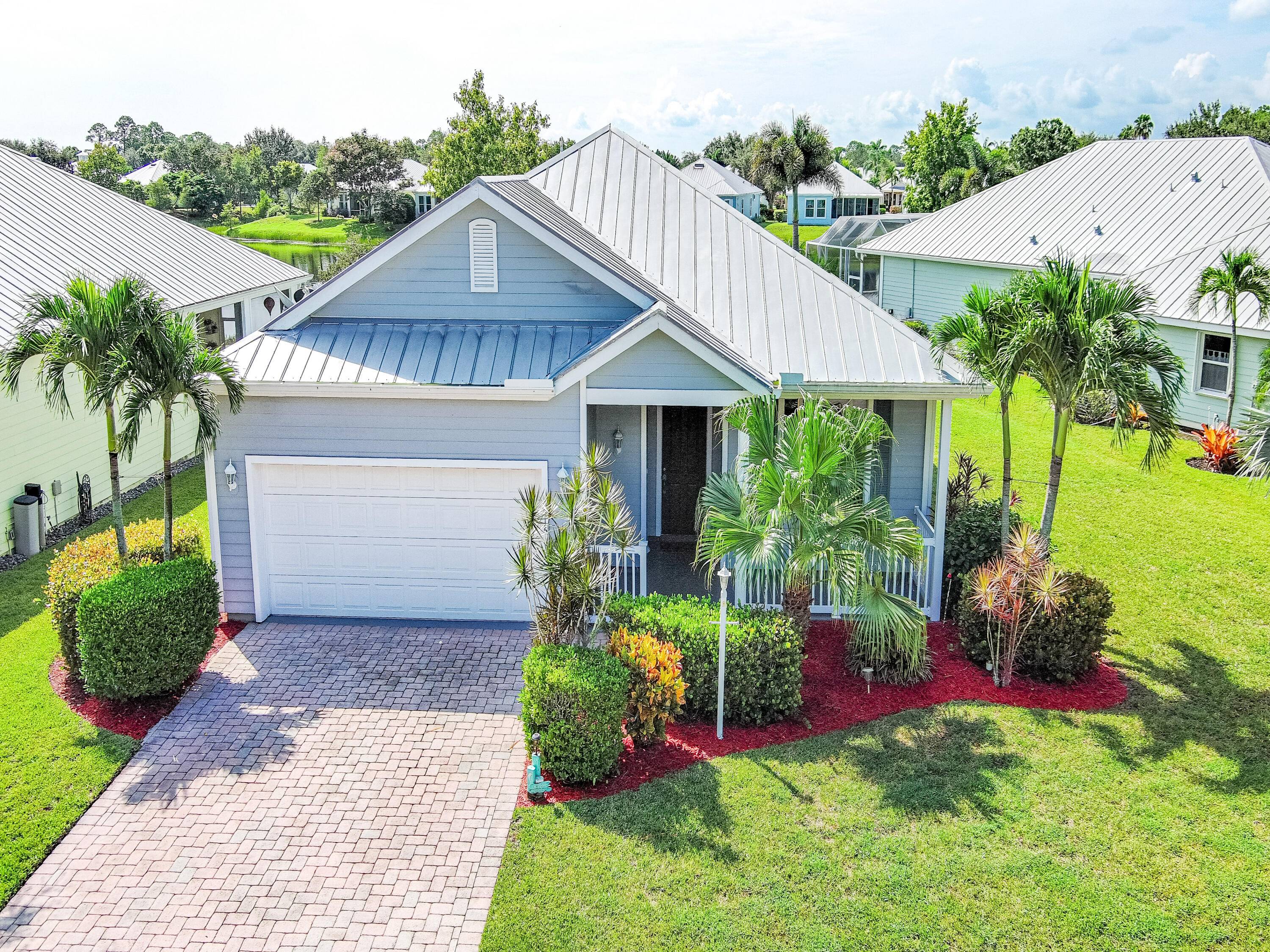 Welcome to this charming Key West style lakefront home, where timeless design meets modern updates.