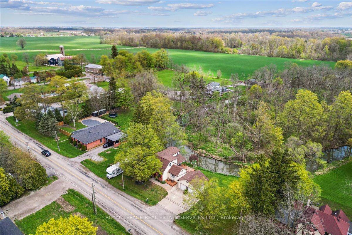 Welcome to this charming 3 1 bedroom, 2 bath home situated on a beautiful lot that offers the perfect blend of peaceful living and convenient proximity to the city.