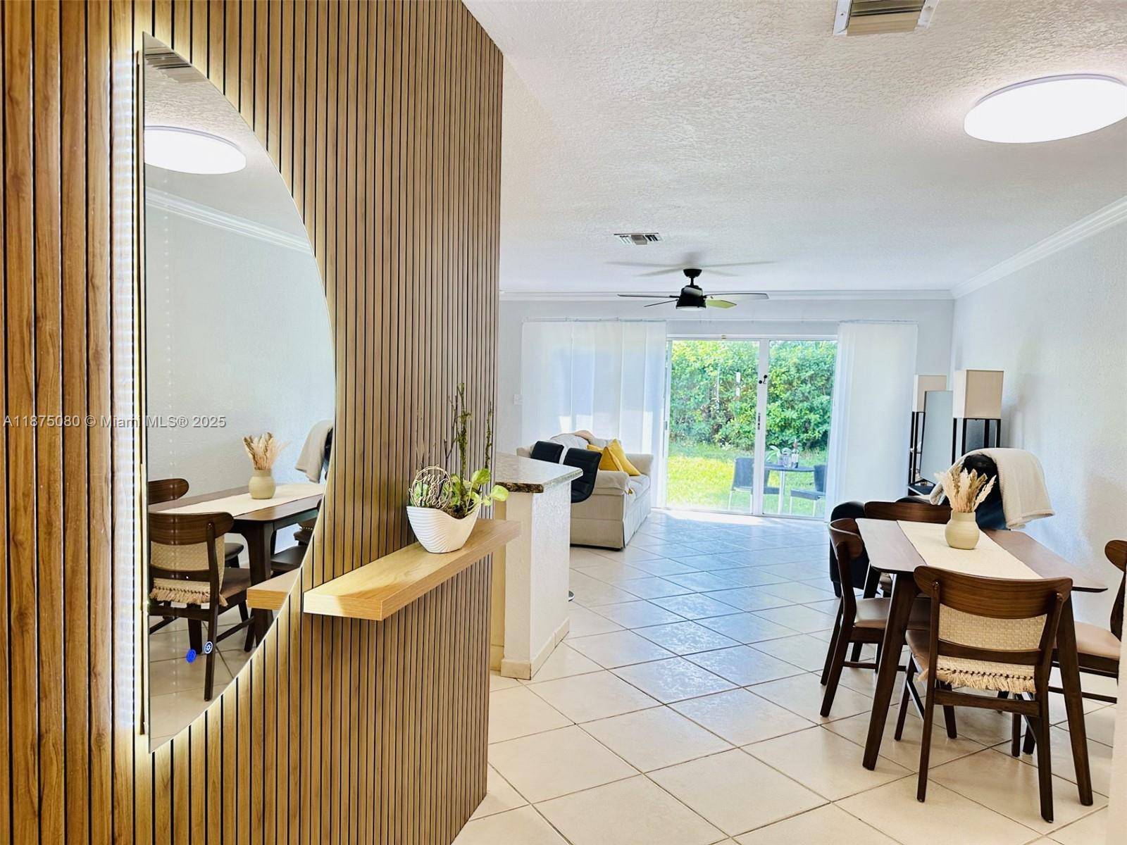 Beautiful 3 bedroom, 2 1 2 bath Townhome featuring kichen granite counters, tile backsplash with under cabinet lighting, and stainless steel appliances including a 2022 Whirlpool microwave, 2022 Bosch dishwasher, ...