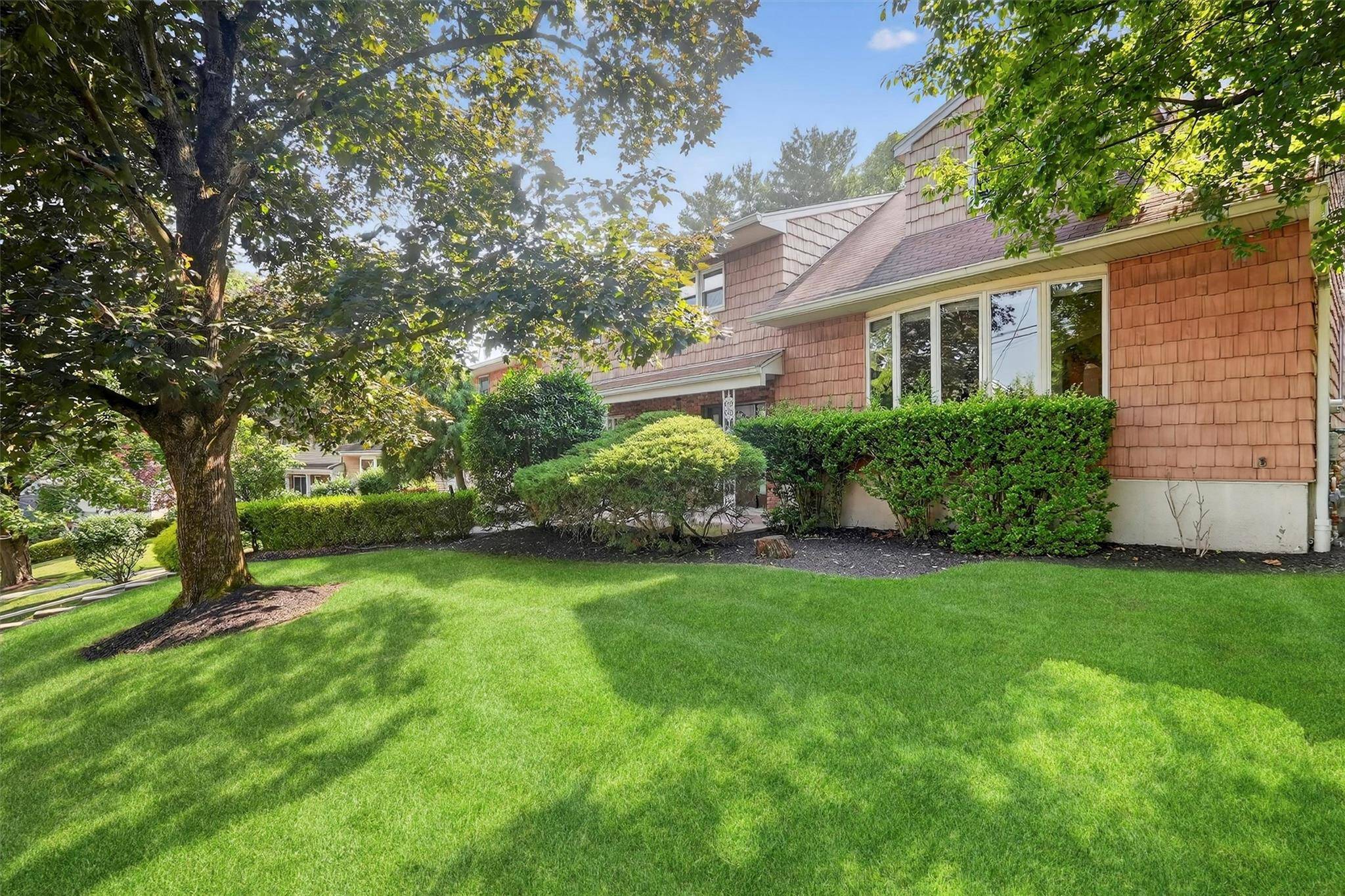 Welcome to 15 Dr. Frank Drive a rare and spacious opportunity in a highly sought after Spring Valley area offering R2 multi family zoning and exceptional versatility.