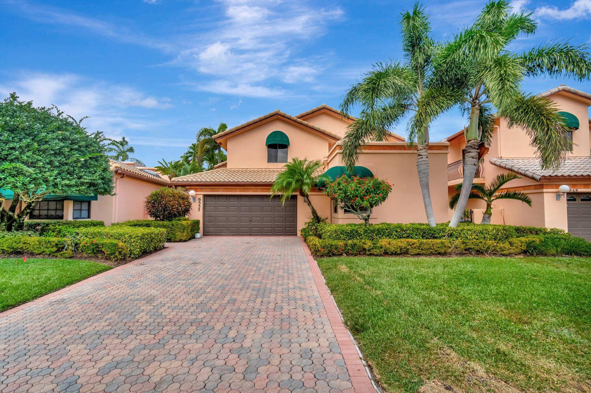 Experience the best of Florida living in this beautifully appointed single family home, nestled in the prestigious, guard gated community of Boca Pointe where Country Club membership is optional.
