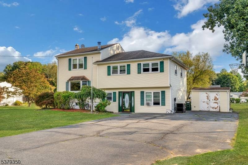Charming split level home on a beautiful half acre lot in a desirable Mount Olive area !