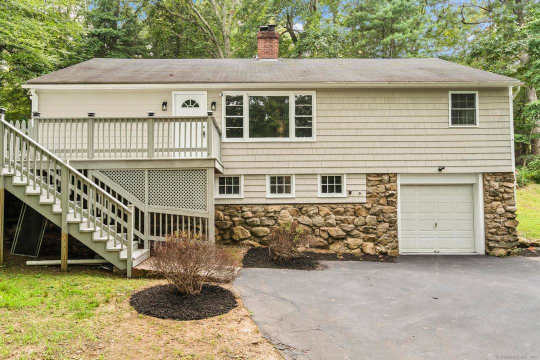 Tucked away in Guilford's sought after Westwoods neighborhood, this beautifully renovated 3 bedroom, 2 bath ranch is the perfect blend of modern updates and natural privacy.