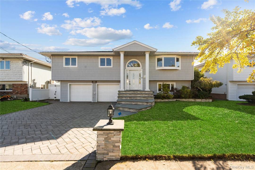 Welcome to this updated and spacious expanded high ranch home located in the desirable Oceanside community !