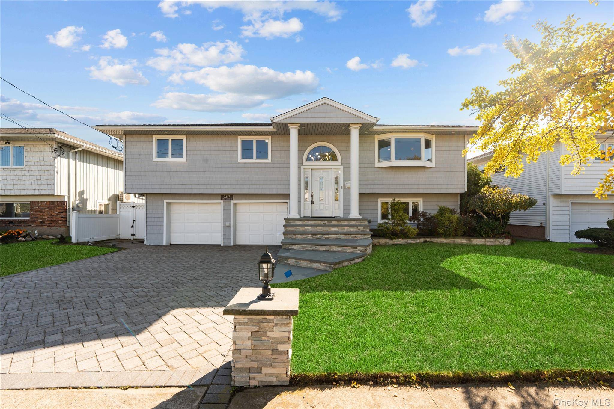 Welcome to this updated and spacious expanded high ranch home located in the desirable Oceanside community !