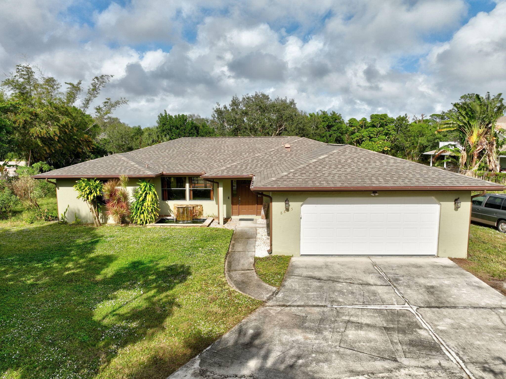 Charming pool home in Papaya Village on a rare 3 4 acre homesite, minutes to the Atlantic Ocean beaches, Jupiter dining and shopping, and Jonathan Dickinson State Park.