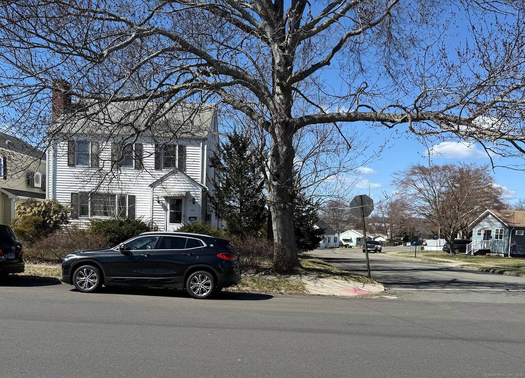 Come see this spacious Colonial situated on a corner lot with two car detached garage.