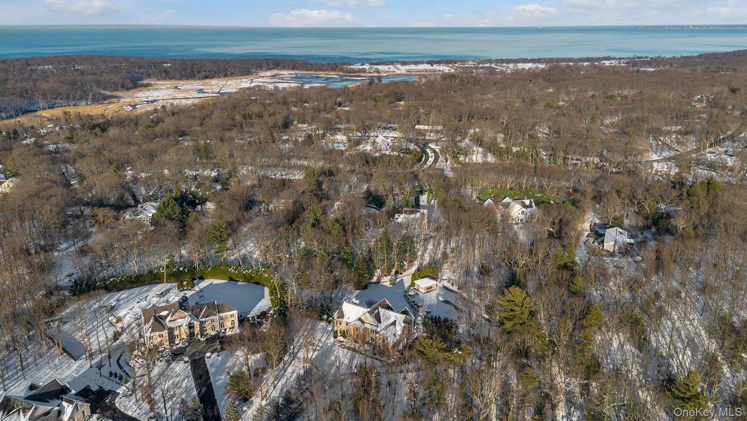 Northport Welcome to this Beautiful, Post Modern Cortez Brick Colonial on a Manicured 2.