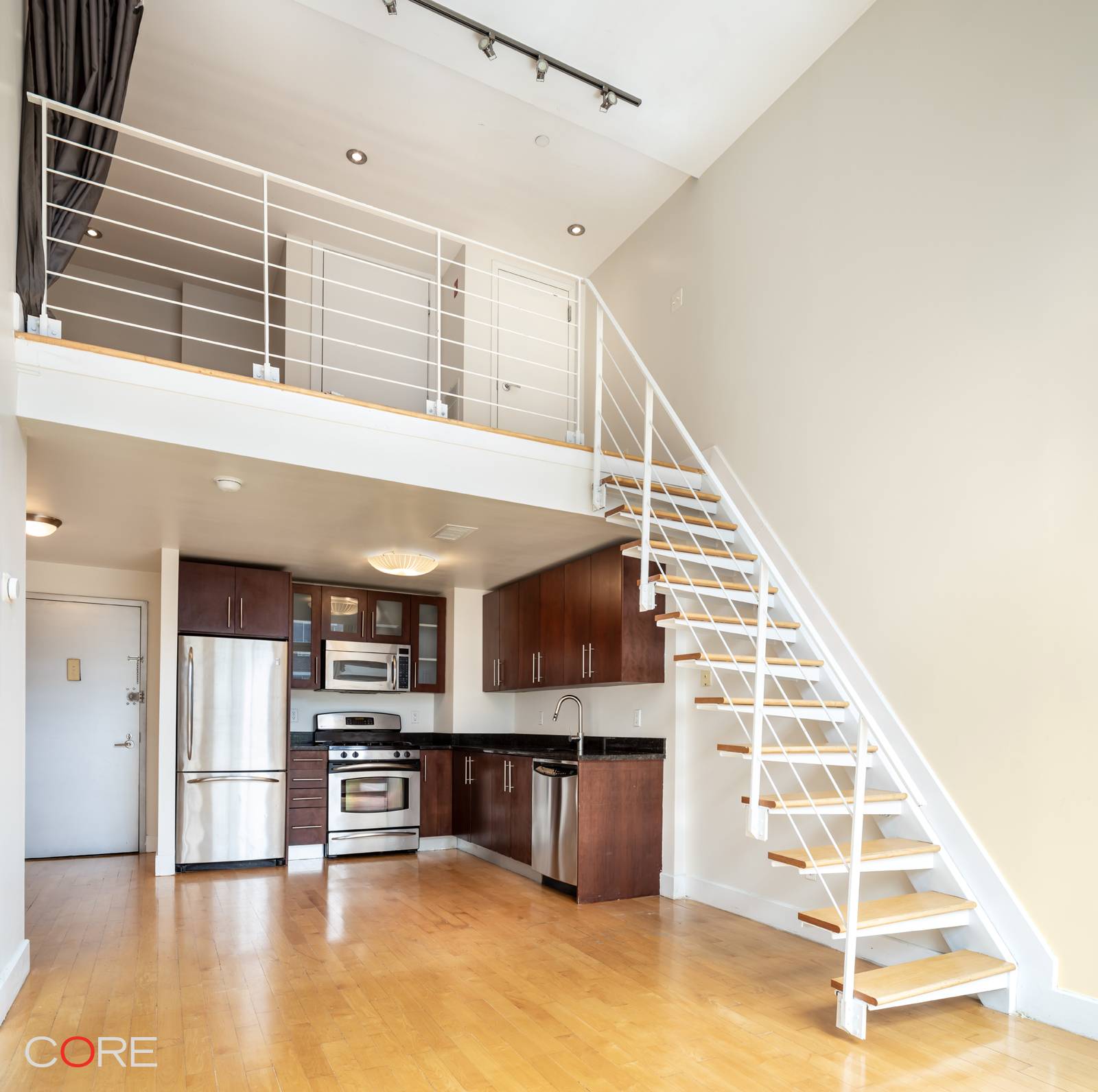 With a tax abatement until 2032, this one bedroom duplex home features a versatile loft and two bathrooms, offering impressive 15 foot ceilings, floor to ceiling windows, and sliding glass ...