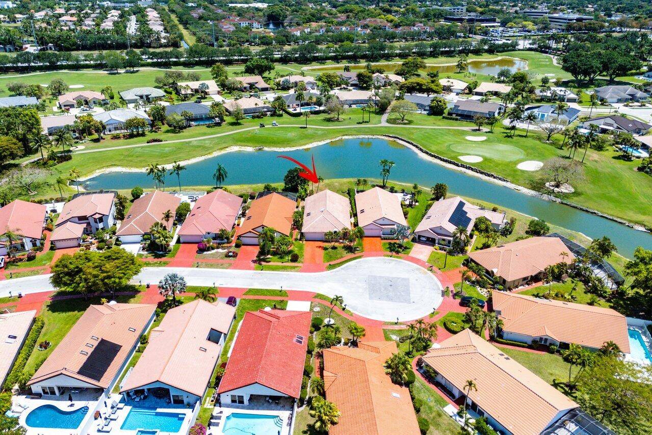 Located in the highly sought after Boca Woods Country Club, renovated 2 bed 2 bath den on lovely cul de sac.