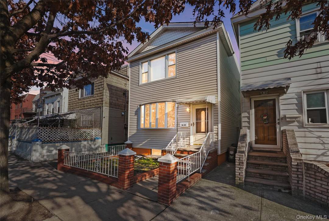 Rarely available in Woodside a fully detached, well maintained two family residence offering the privacy of a standalone home with strong rental income to support ownership.