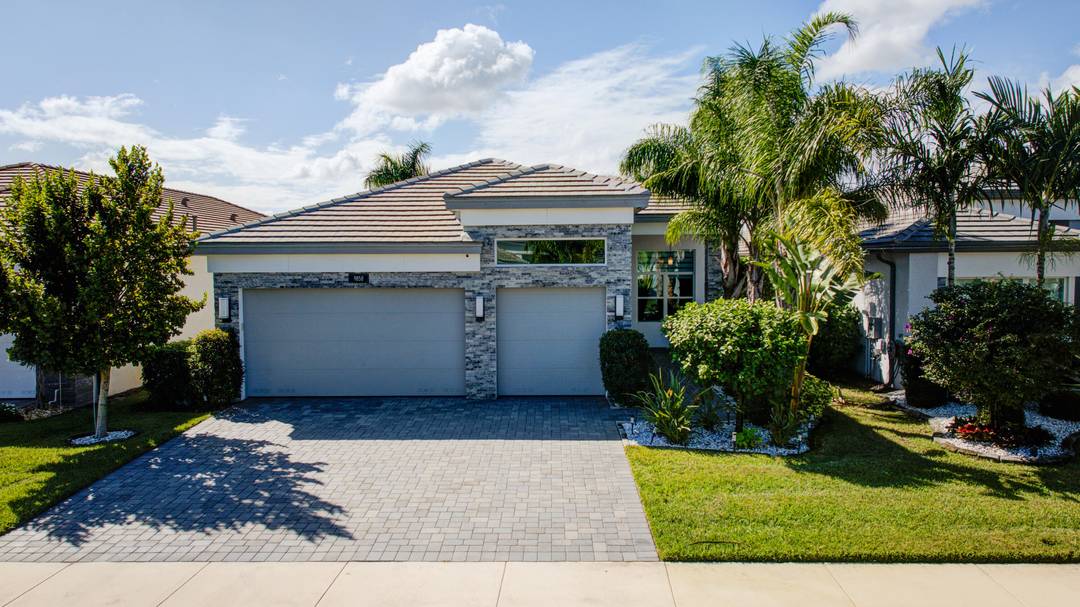 Magnificent Turnkey 3 Bedroom Home with Lake Views in Valencia Sound Boynton Beach's Premier 55 Community !