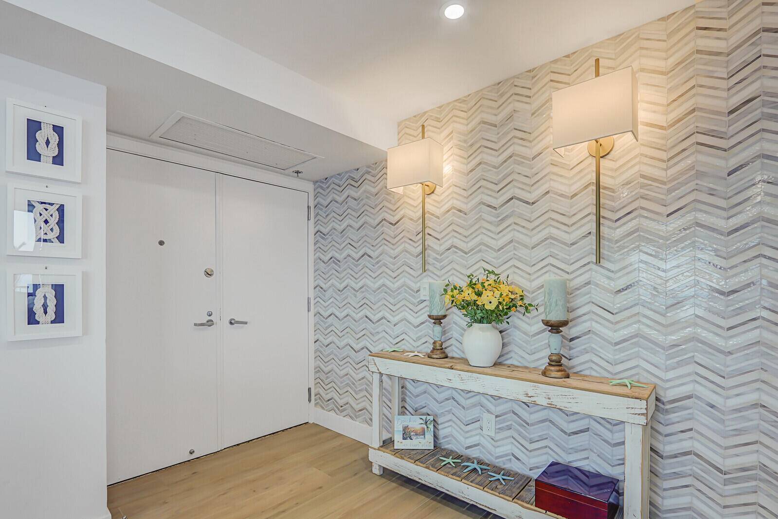 Discover coastal luxury in this completely remodeled condo in the exclusive Water Glades community, on the north end of Singer Island.