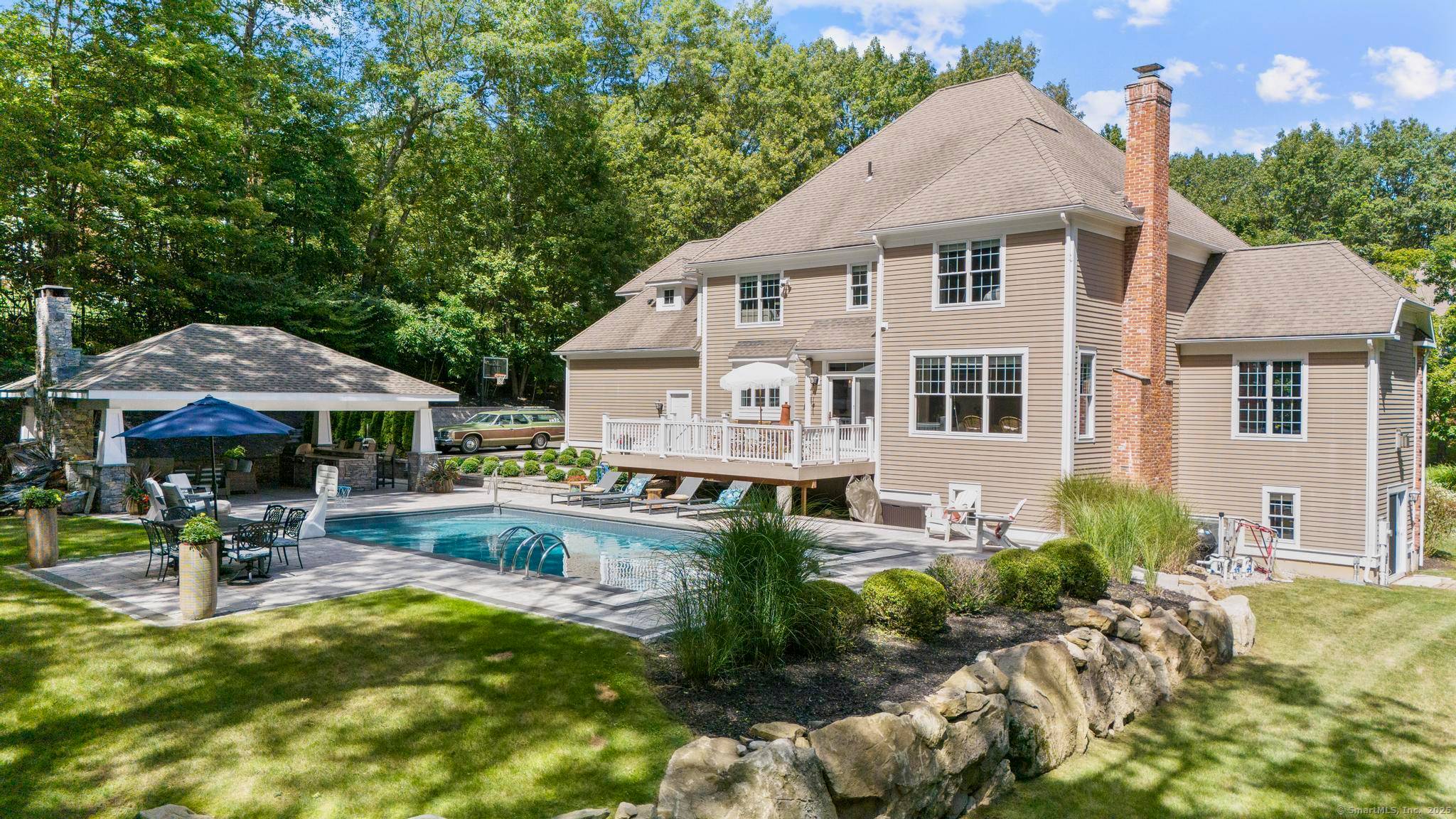 This beautifully renovated, beach house inspired brick colonial offers over 5, 000 sqft of sun drenched, thoughtfully designed living space with 4 bedrooms, 3.