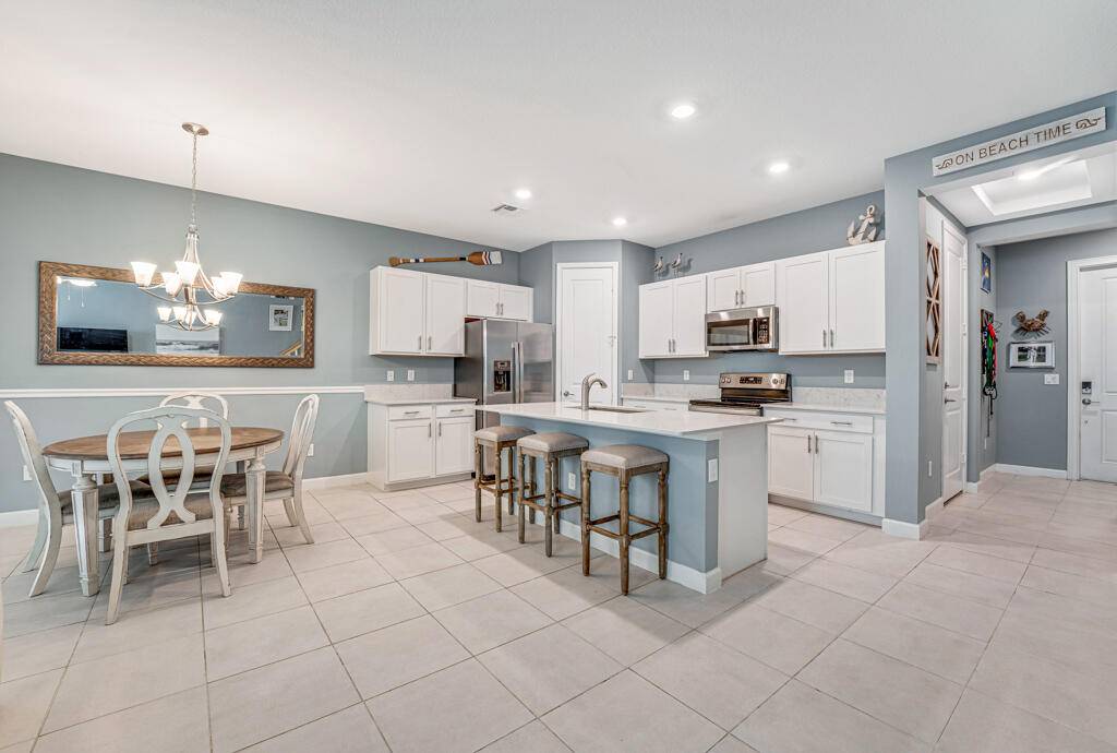Discover modern comfort in this stunning 2020 built home located in Arbor Parc, a centrally situated gated community in Riviera Beach.