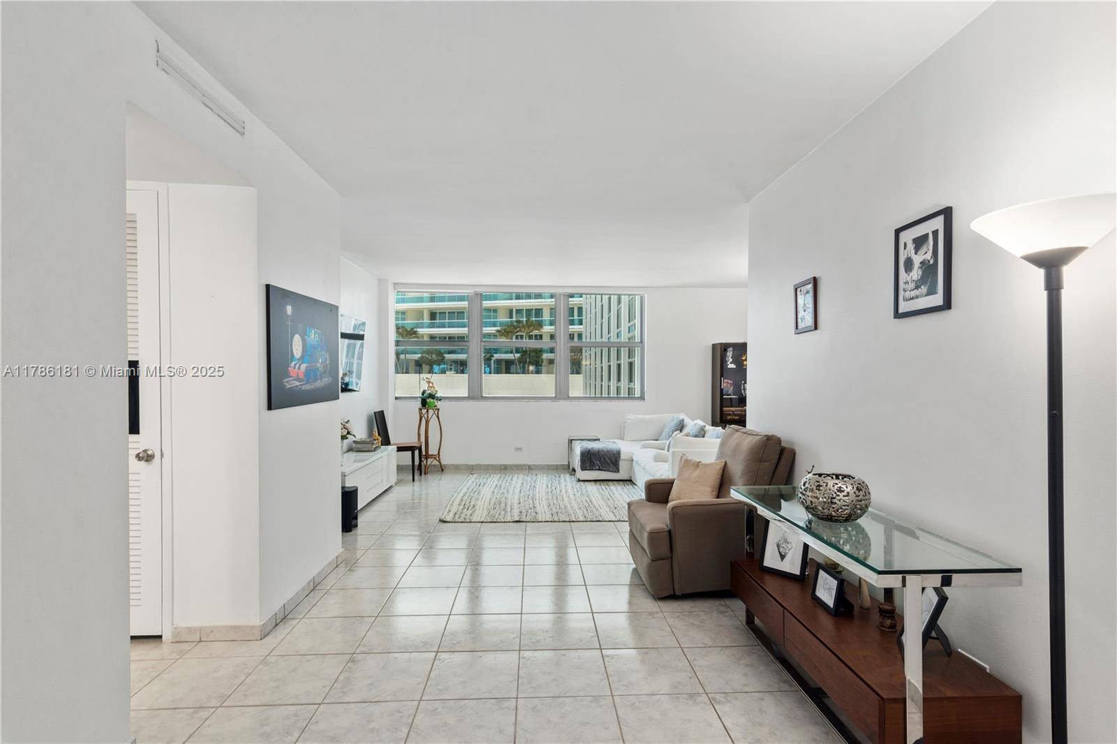HUGE 1 BEDROOM UNIT WITH PARTIAL OCEAN VIEWS, NEW IMPACT WINDOWS.