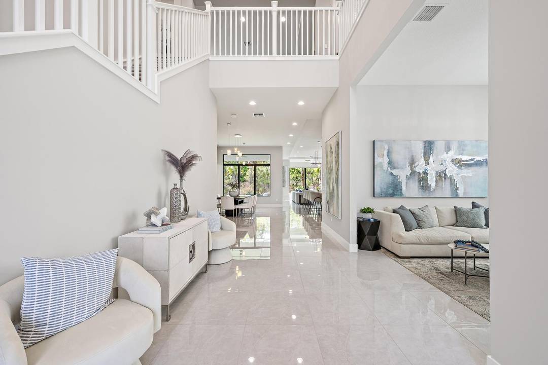 Welcome to 13358 Artisan Circle, a pristine, never lived in residence set within the exclusive, manned gated community of Artistry in Palm Beach Gardens.