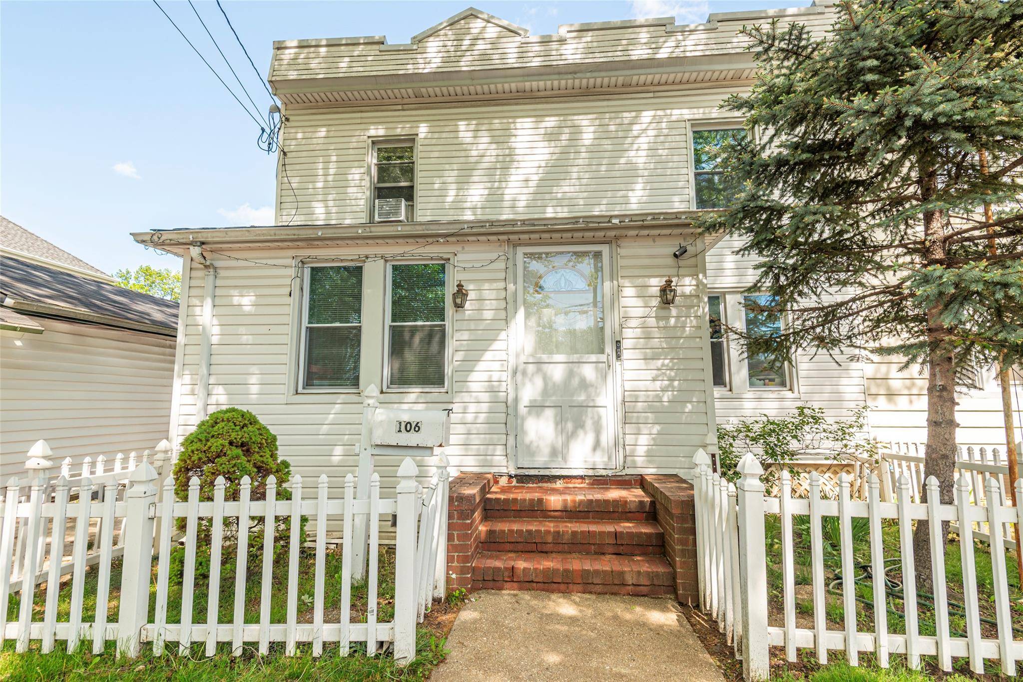 Bright and sunny large semi detached Townhouse in the heart of New Hyde Park !
