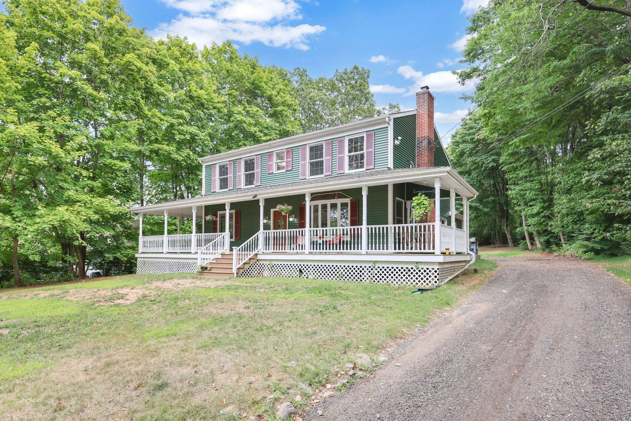 Welcome to this expanded Colonial home set on over 3 private acres across from The Farms Country Club.